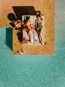MARPH-OASIS-POOL-THREE-WOMEN-SUNBED-POOL